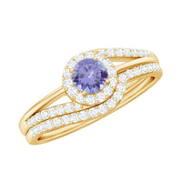 Genuine Tanzanite engagement ring with diamond enhancer, featuring a stunning violet-blue tanzanite gemstone and sparkling diamond accents.