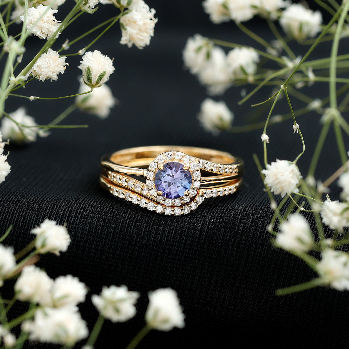 Genuine Tanzanite engagement ring with diamond enhancer, featuring a vibrant blue Tanzanite gemstone set in a rose gold ring.