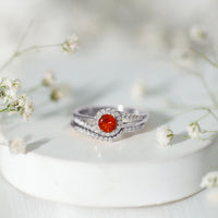 Certified fire opal engagement ring with diamond enhancer, featuring a stunning fiery orange opal set in a elegant ring design.