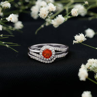 Certified fire opal engagement ring with diamond enhancer and rose gold band, featuring intricate detailing and sparkling stones.
