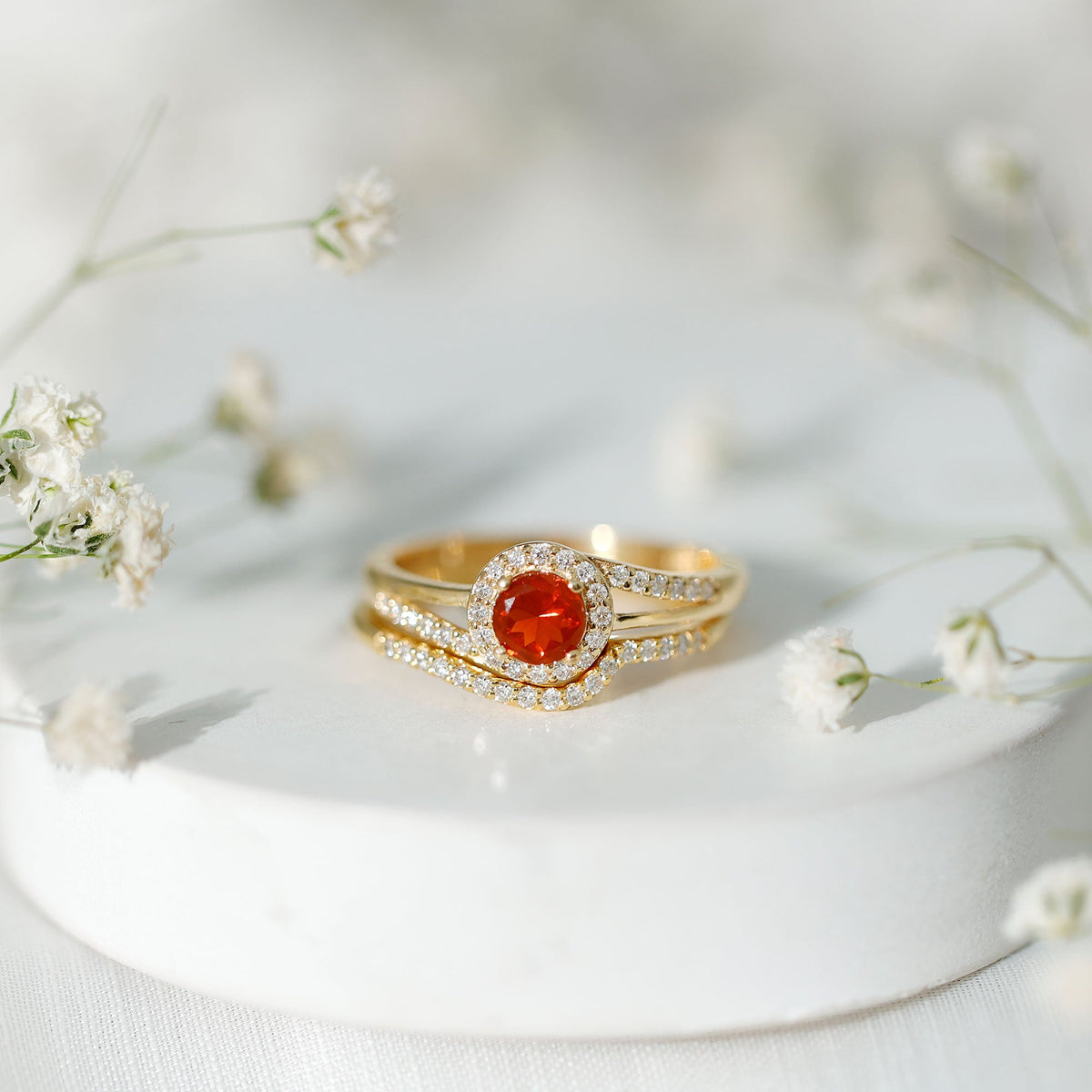 Certified fire opal engagement ring with diamond enhancer from Rosec Jewels, showcasing a vibrant fire opal centerpiece and sparkling diamonds.