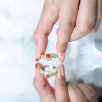Certified fire opal engagement ring with diamond enhancer featuring a vibrant orange fire opal and sparkling diamonds in a rose gold setting