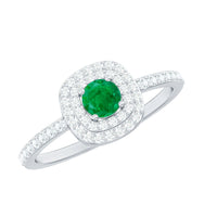Round emerald and diamond double halo engagement ring with rose gold band from Rosec Jewels, featuring intricate detailing and sparkling gemstones.