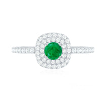 Round emerald and diamond double halo engagement ring by Rosec Jewels, featuring a central emerald with sparkling diamond accents.