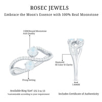 Minimal moonstone and diamond engagement ring by Rosec Jewels featuring a sleek band and sparkling gemstones.