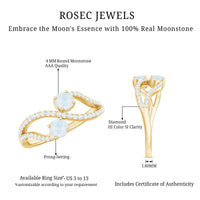 Minimal moonstone and diamond engagement ring from Rosec Jewels, showcasing a delicate band with moonstone centerpiece and sparkling diamonds.