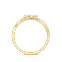 Minimal moonstone and diamond engagement ring by Rosec Jewels, featuring a delicate band with a shimmering moonstone center and diamond accents.