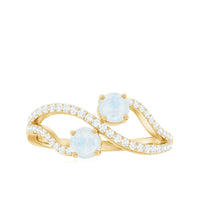 Minimal moonstone and diamond engagement ring by Rosec Jewels, showcasing a sleek silver band with a moonstone and diamond accents.