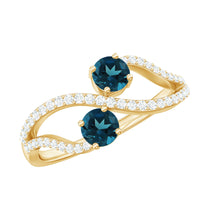 Rosec Jewels London Blue Topaz 2-stone promise ring with diamonds, featuring a detailed view of the elegant gemstone setting.