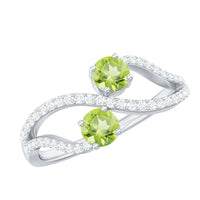 Natural Peridot Toi Et Moi ring with diamond infinity shank by Rosec Jewels, featuring two peridot gemstones and sparkling diamond accents.
