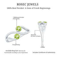 Natural Peridot Toi Et Moi ring with diamond infinity shank by Rosec Jewels, showcasing the vibrant green peridot and sparkling diamonds.