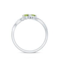 Natural Peridot Toi Et Moi ring with diamond infinity shank by Rosec Jewels, showcasing a green peridot gemstone and sparkling diamonds.