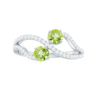 Natural Peridot Toi Et Moi ring with diamond infinity shank from Rosec Jewels, featuring two peridot gemstones and a diamond-accented band.