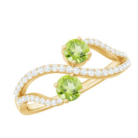Natural Peridot Toi Et Moi ring with diamond infinity shank, showcasing a dual gemstone design and elegant craftsmanship.