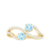 Two-tone aquamarine and diamond infinity promise ring for women by Rosec Jewels, featuring elegant stone detailing and intricate band design.