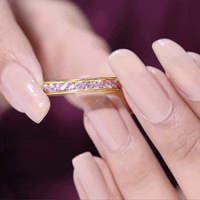 Rosec Jewels round lab-created pink sapphire half eternity band with channel setting, featuring sparkling pink sapphires on a sleek ring.