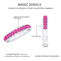 Rosec Jewels round lab-created pink sapphire half eternity ring with channel setting, showcasing a sleek band with pink gemstones.