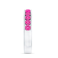Round Lab Created Pink Sapphire half eternity band ring in channel setting, showcasing sparkling pink sapphires on a silver band.