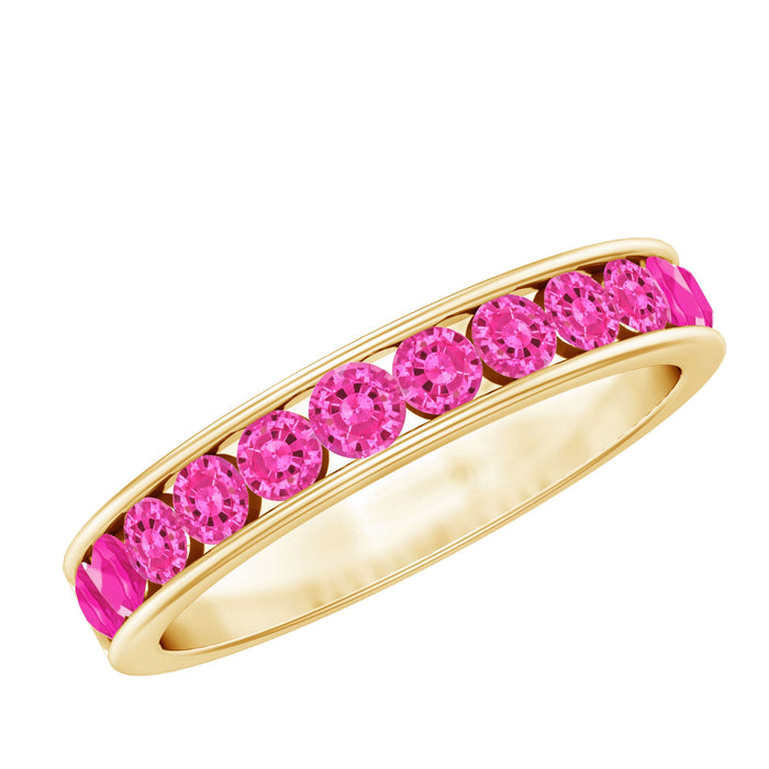 Round lab-created pink sapphire half eternity ring in channel setting by Rosec Jewels, showcasing sparkling pink sapphires on a sleek band.