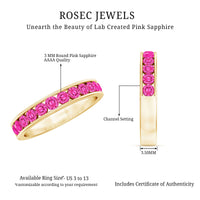 Round lab-created pink sapphire half eternity band ring in channel setting by Rosec Jewels, showcasing pink sapphires and polished gold band.