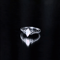 Natural Ethiopian opal diamond engagement ring with Celtic knot design, featuring yellow gold band and sparkling gemstones.