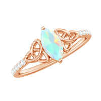 Natural Ethiopian opal diamond engagement ring with Celtic knot design, featuring a sparkling opal and intricate silver Celtic details.
