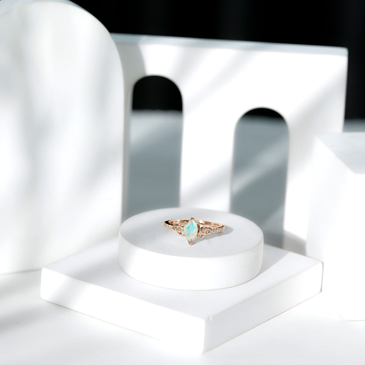 Natural Ethiopian opal diamond engagement ring with Celtic knot design, crafted by Rosec Jewels, featuring a stunning gemstone centerpiece.