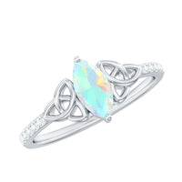 Natural Ethiopian Opal diamond engagement ring with Celtic knot design, featuring a sparkling opal and intricate silver band.