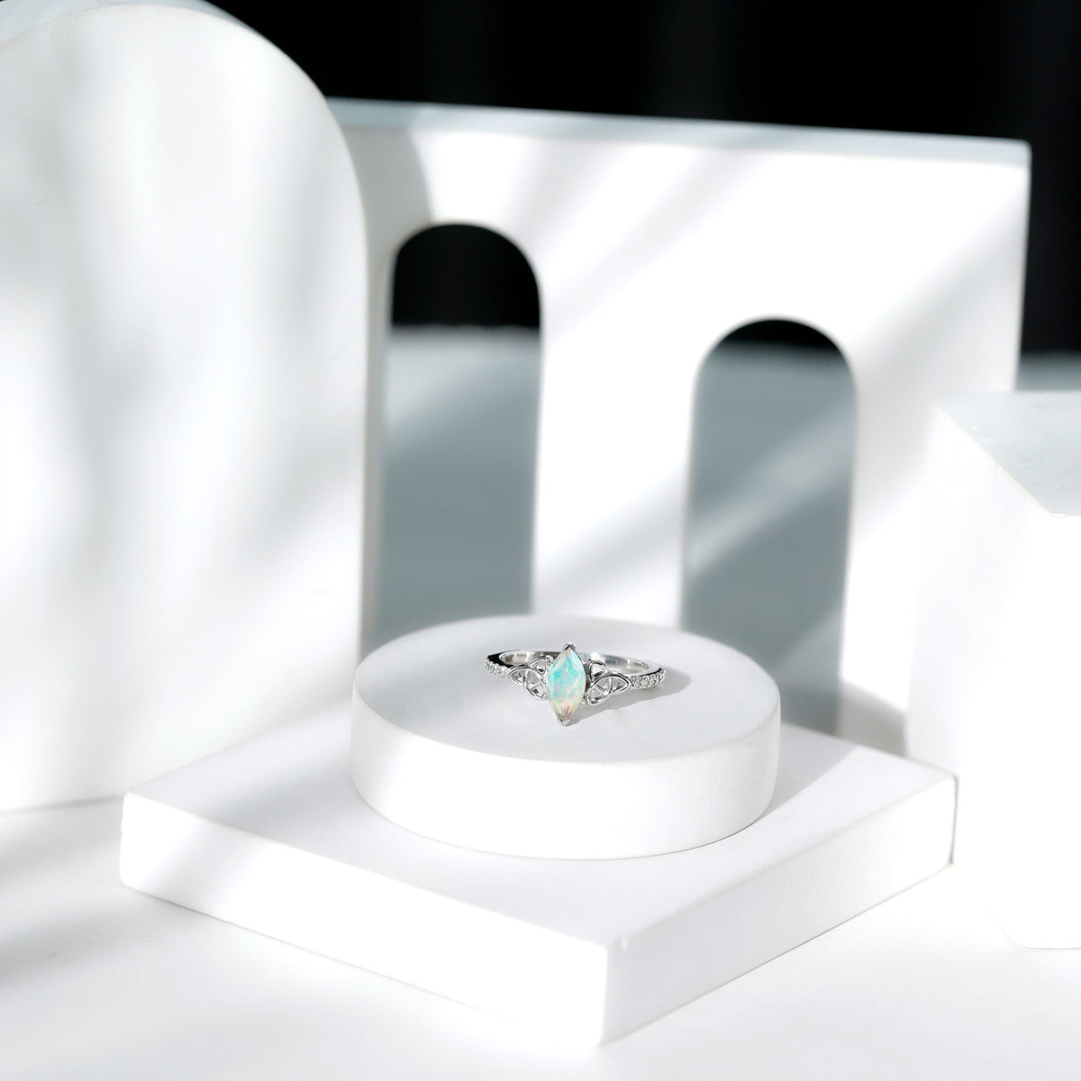 Natural Ethiopian opal diamond engagement ring with Celtic knot design, crafted by Rosec Jewels, showcasing intricate sterling silver detailing.