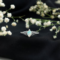 Natural Ethiopian opal diamond engagement ring with Celtic knot design, featuring sparkling gemstones in a Rosec Jewels ring.