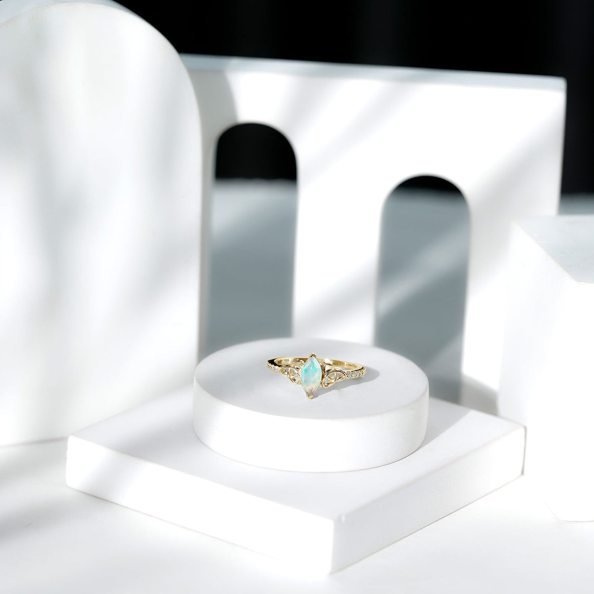 Natural Ethiopian opal diamond engagement ring with Celtic knot design, featuring a Rosec Jewels ring in elegant gold setting.