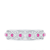 Rosec Jewels lab-created pink sapphire wedding band with intricate Celtic details, showcasing a polished ring design.