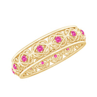 Pink sapphire wedding band with Celtic details from Rosec Jewels, showcasing a lab-created pink sapphire set in a decorative ring.