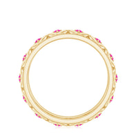 Lab-created pink sapphire wedding band with Celtic details, crafted by Rosec Jewels, showcasing intricate design and vibrant pink stones.
