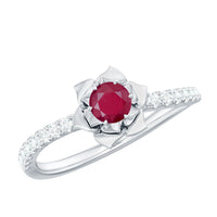 Natural 0.6 carat ruby flower engagement ring with diamonds, featuring a rose gold band and intricate floral design.