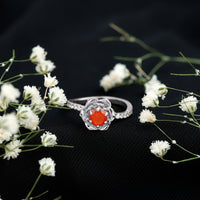 Rosec Jewels 0.45 carat fire opal flower engagement ring with diamond accents, showcasing a vibrant orange gemstone and intricate design.
