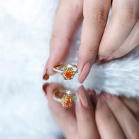 Rosec Jewels 0.45 carat fire opal flower engagement ring with diamond, featuring vibrant orange opal and sparkling diamond accents.