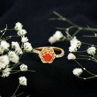 Rosec Jewels 0.45 Carat Fire Opal flower engagement ring with diamond, showcasing intricate floral design and sparkling gemstone details.