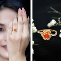 Rosec Jewels 0.45 carat fire opal flower engagement ring with diamond, featuring intricate floral design and sparkling gemstone accents.