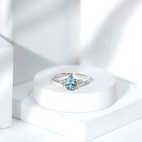 Elegant 1 Carat Aquamarine pear-shaped engagement ring with diamond trio accents from Rosec Jewels.