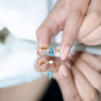 Rosec Jewels 1 Carat Aquamarine Pear Engagement Ring with diamond trio, showcasing the elegant gemstone and sparkling side stones.