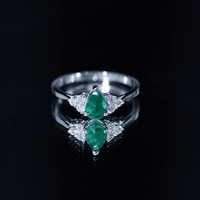Pear-shaped emerald engagement ring with 0.6 carat AAA quality gemstone and diamond accents by Rosec Jewels.