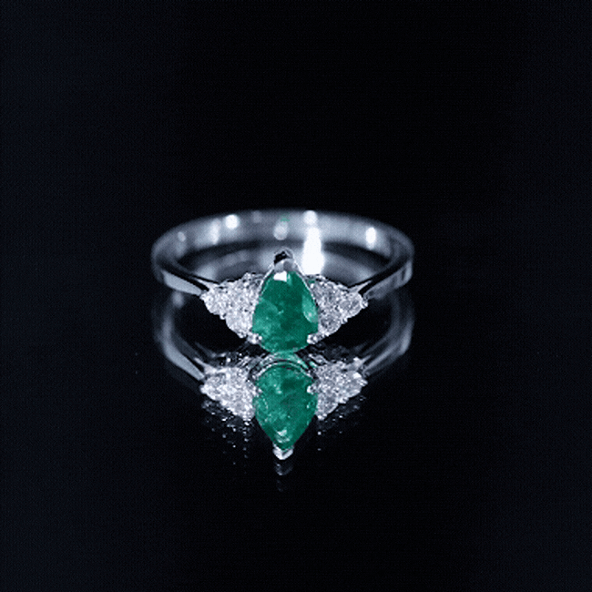 Pear-shaped emerald engagement ring with 0.6 carat AAA quality gemstone and diamond accents, crafted by Rosec Jewels.