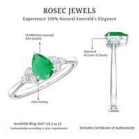 Pear-shaped emerald engagement ring with 0.6 carat AAA quality gemstone and diamonds, featuring a delicate band from Rosec Jewels.