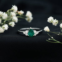 Pear-shaped emerald engagement ring with 0.6 carat AAA quality gemstone and diamond accents by Rosec Jewels