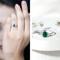 Pear-shaped emerald engagement ring with 0.6 carat AAA quality gemstone and diamond accents, set in a Rosec Jewels ring.