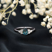 5X7mm Pear Shape London Blue Topaz Engagement Ring with Diamond Trio