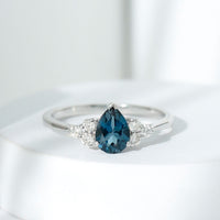 5X7mm Pear Shape London Blue Topaz Engagement Ring with Diamond Trio