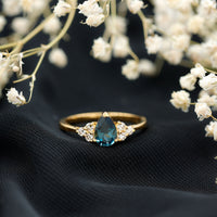 5X7mm Pear Shape London Blue Topaz Engagement Ring with Diamond Trio