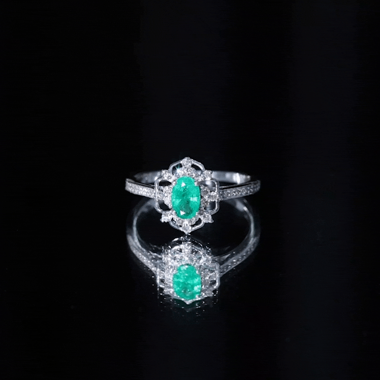 Vintage style emerald and diamond oval engagement ring by Rosec Jewels, featuring a yellow gold band and intricate detailing.